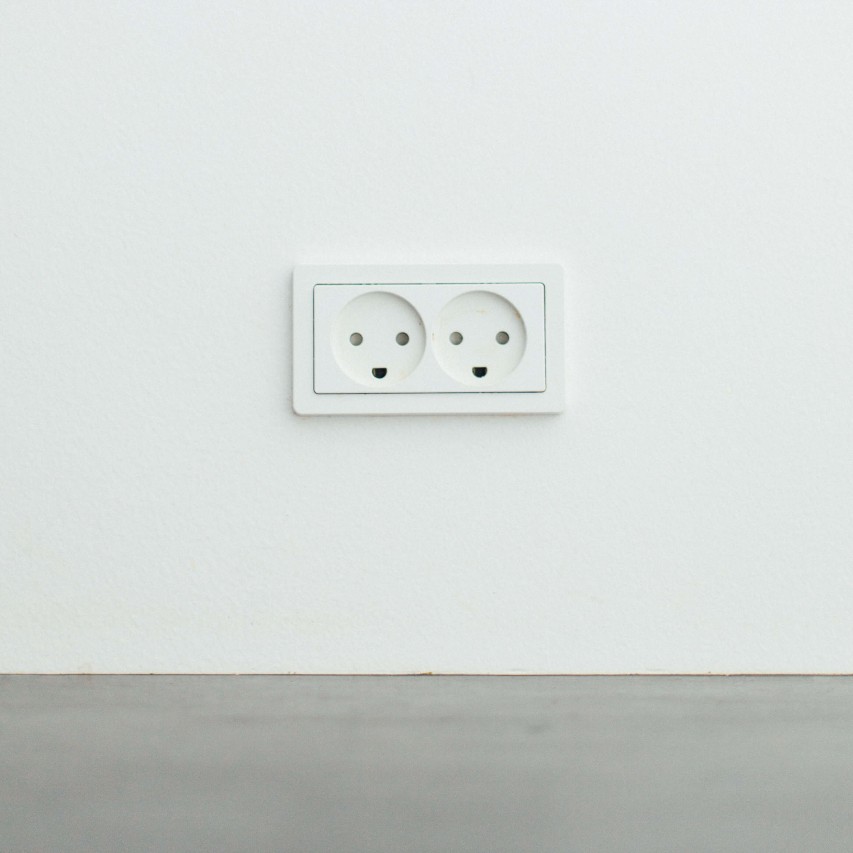 A plug socket to represent electrical building surveying.